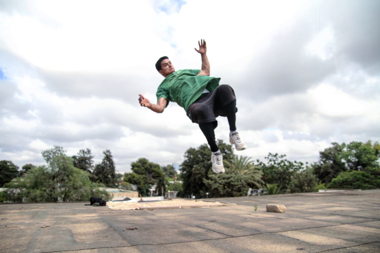 WOMAN JUMPING IN SKY