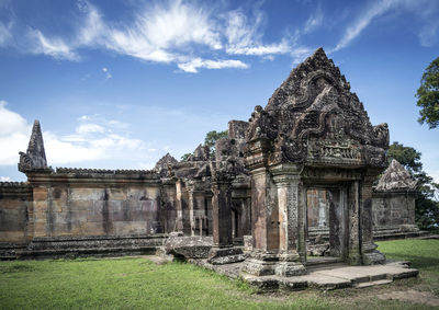 Old temple against cloudy sky