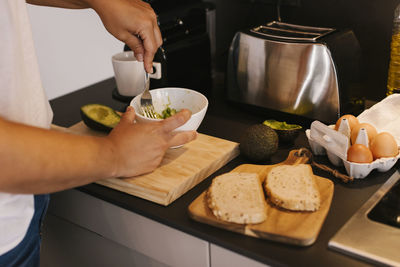 Concentrated woman preparing breakfast