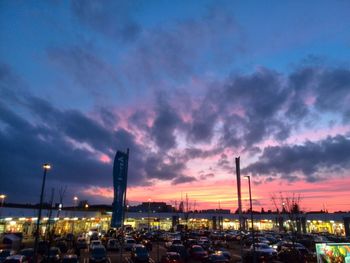 View of harbor against cloudy sky