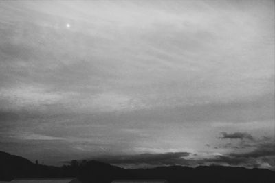 Low angle view of silhouette mountain against sky
