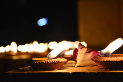 Close-up of lit candles on birthday cake