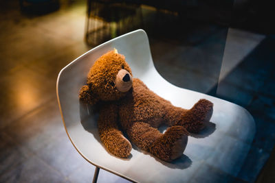 High angle view of stuffed toy on chair