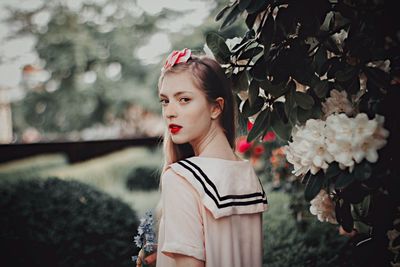 Portrait of girl holding flower