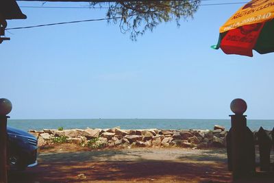 Scenic view of beach against clear sky