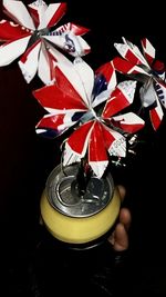 Close-up of red candle on white background