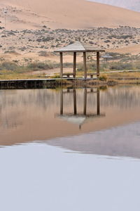 1039 lake badain east-wooden gazebo on the shore. badain jaran area gobi desert. nei mongol-china.