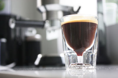 Close-up of coffee in glass on table