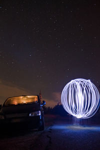 Low-angle view of a car on road at night - lightpainting