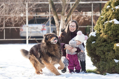 Full length of woman on snow during winter