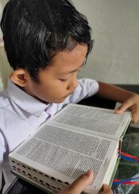 Boy holding book