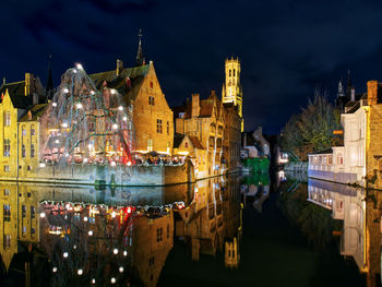 Illuminated buildings in water