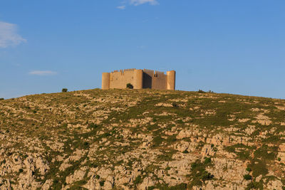 The medieval castle of montgri in gerona with mountain. concept of ancient constructions 