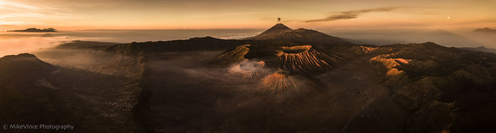 Panoramic view of volcanic landscape against sky during sunset