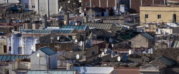 High angle view of satellite dishes on building terraces