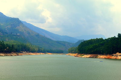 Scenic view of landscape and mountains against sky