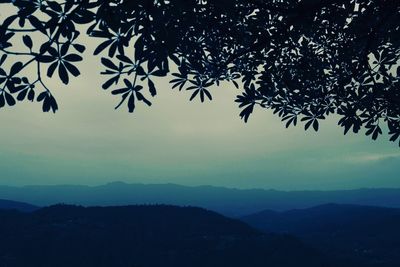 Scenic view of silhouette mountains against clear sky