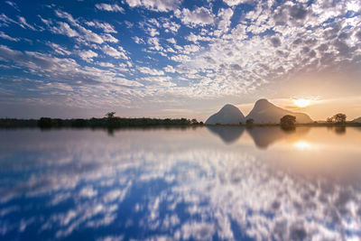 Scenic view of lake against sky during sunset