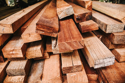 Full frame shot of wooden logs in forest