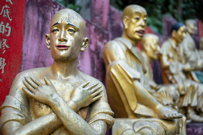 Statue of buddha against building