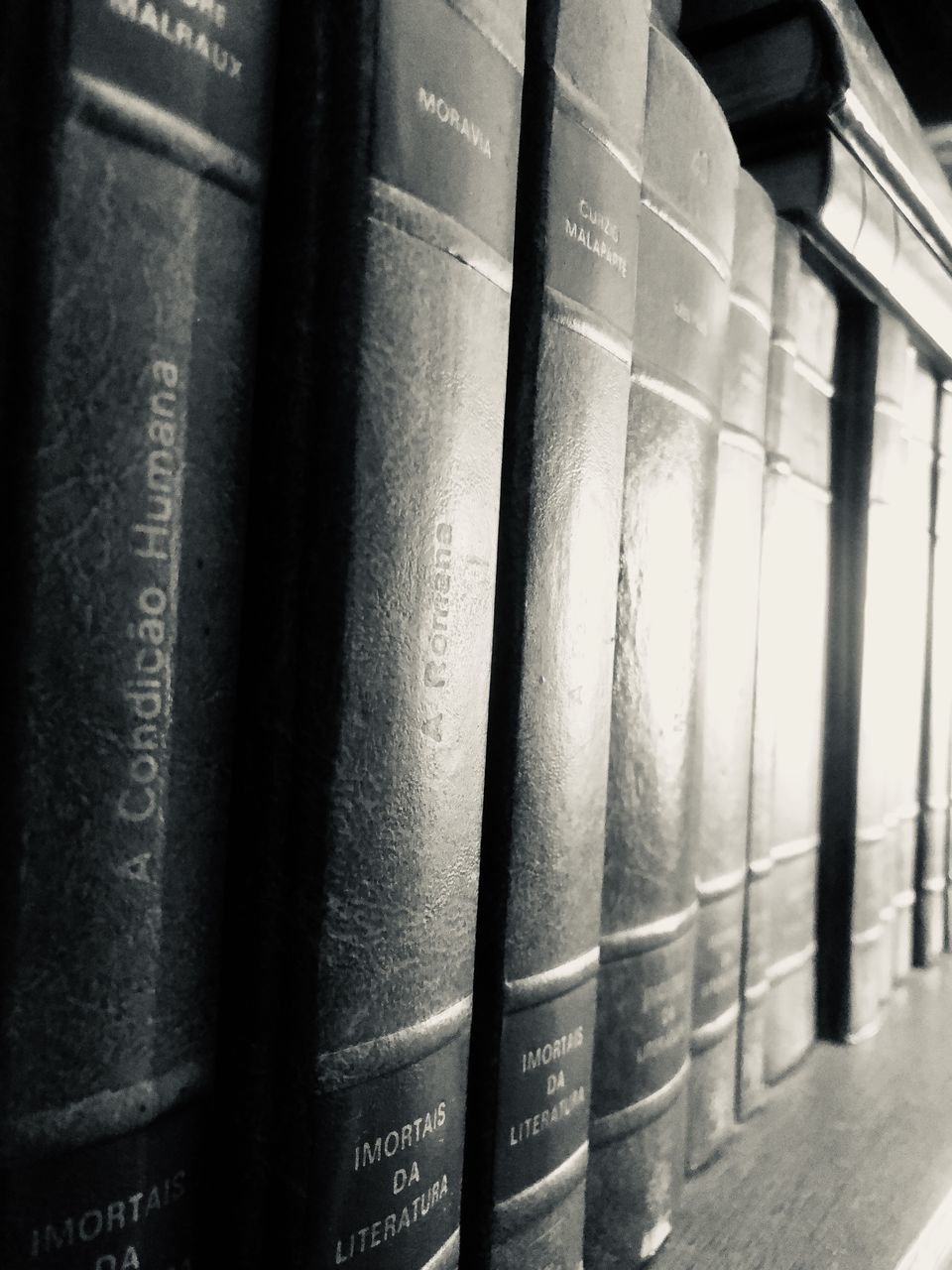 CLOSE-UP OF OLD BOOKS IN SHELF