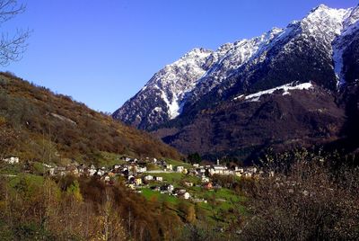 Scenic view of snowcapped mountains against clear sky