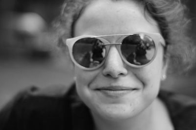 Close-up portrait of smiling man wearing sunglasses