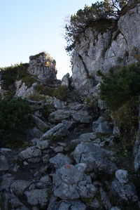 Rock formations on landscape against sky