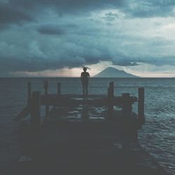 Scenic view of sea against cloudy sky