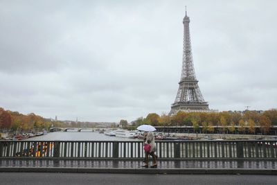 Eiffel tower with river in background