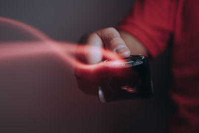 Close-up of hand holding mobile phone