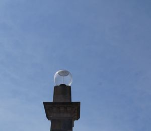 Low angle view of street light against sky