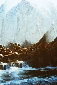 Scenic view of sea against sky during winter