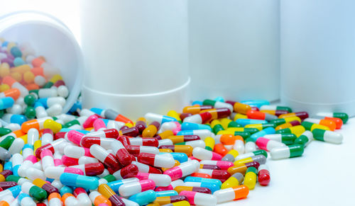 Pile of antibiotic capsule pills with plastic bottle. antibiotic drug resistance. antimicrobial drug