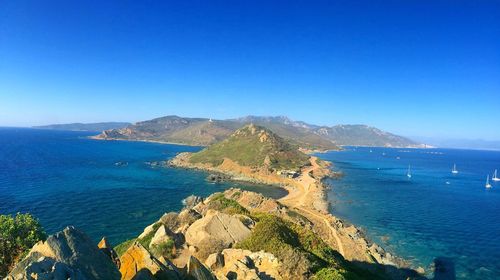 Scenic view of calm sea against clear sky