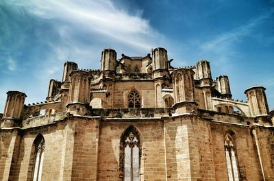 Low angle view of church against blue sky