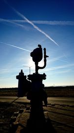 Silhouette of man against sky