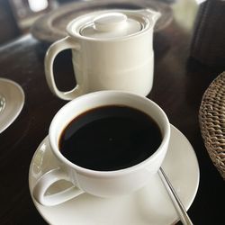 High angle view of coffee cups on table