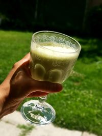 Close-up of hand holding drink