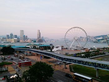 Ferris wheel in city against sky