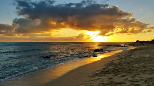 Scenic view of sea at sunset