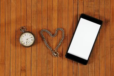 High angle view of clock on table