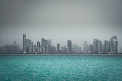 Skyline of panama city in a cloudy day seen from the water