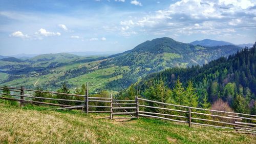 Scenic view of landscape and mountains against sky