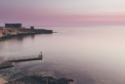 High angle view of jetty in sea against sky