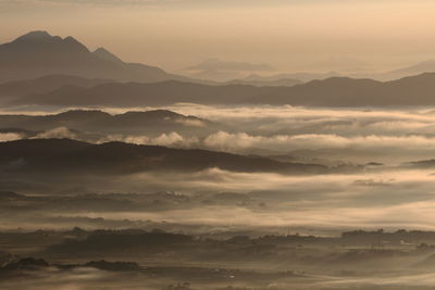 Scenic view of mountains against sky during sunset