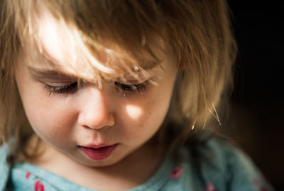 Close-up of cute girl at home