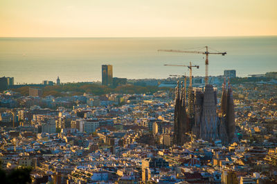 High angle view of city buildings during sunset