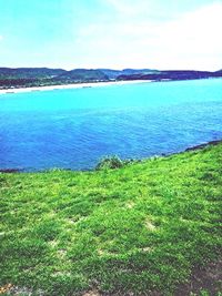 Scenic view of sea against cloudy sky