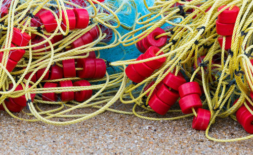 High angle view of fishing nets on sand